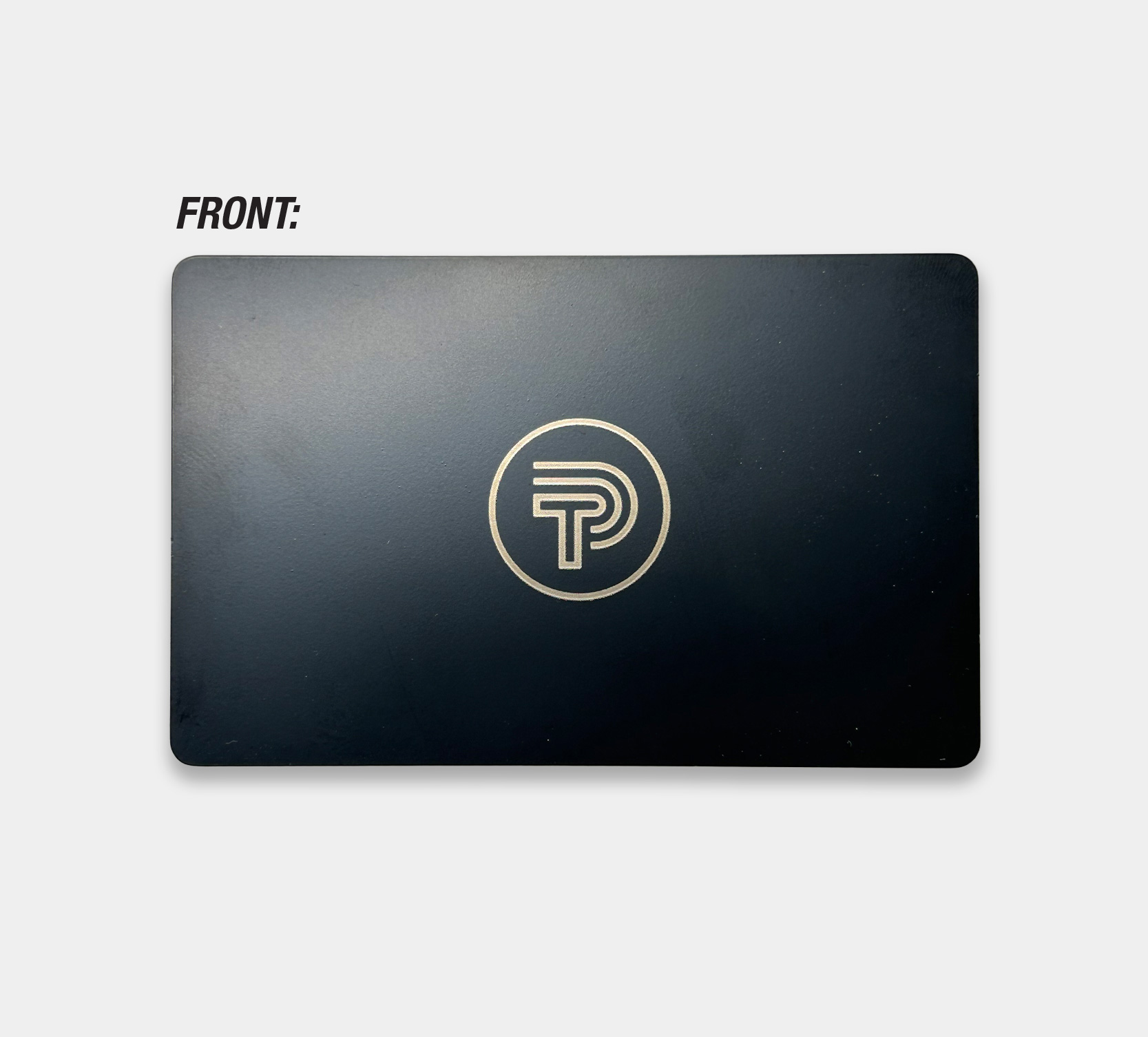 Image showing front of Black metal NFC business card with Tap Ping logo engraved in gold